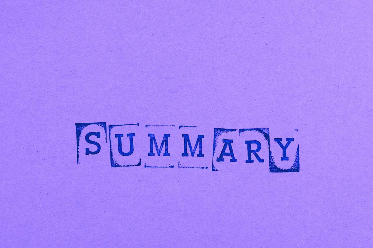 Close-Up Shot of a Text on a Green Surface