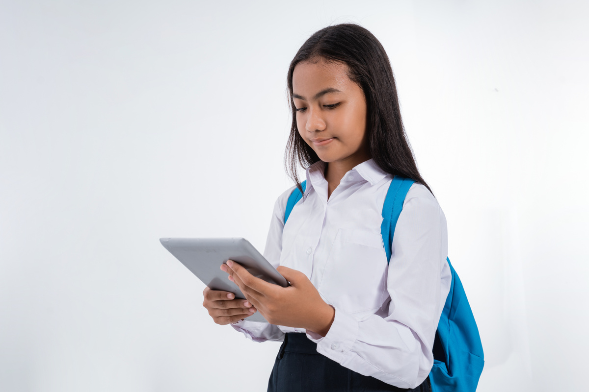 Girl Junior High School Student Using Tablet Pc